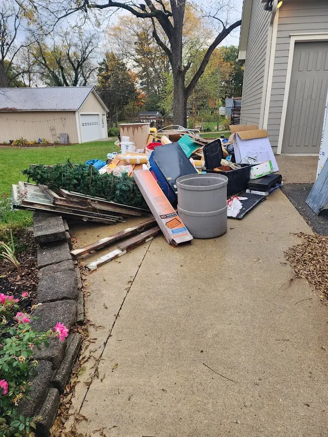 Dumpster being loaded with debris for 3 Yard Dumpster Rental in Walbridge